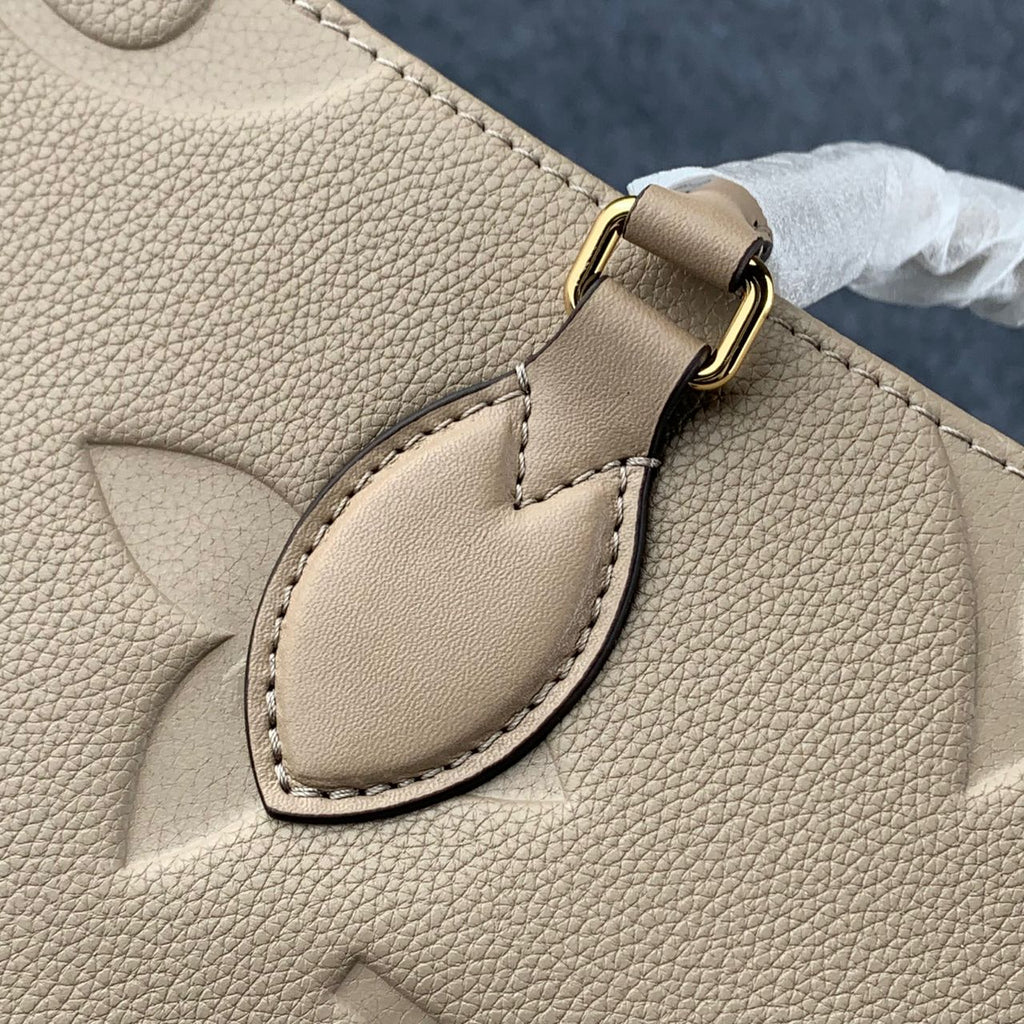 LV Onthego MM Beige Monogram Empreinte Tote Bag